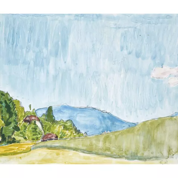 Bauernhof mit Blick auf einen blauen Hügel