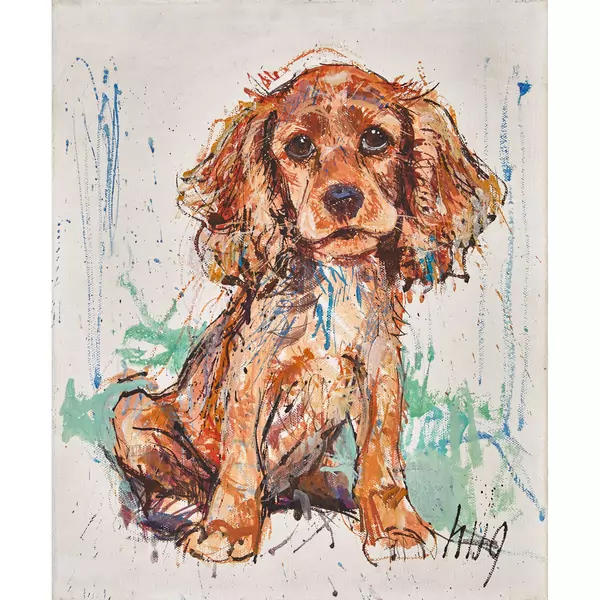 Sitzende Spanielwelpe