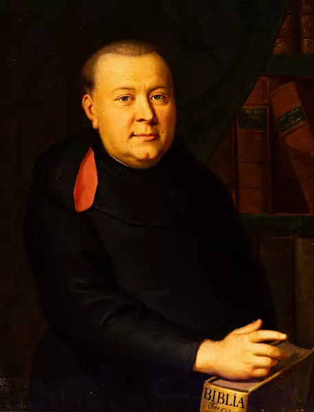 Halbfigur eines Geistlichen mit der Biblia sacra