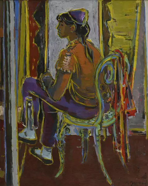 Femme assise devant un miroir