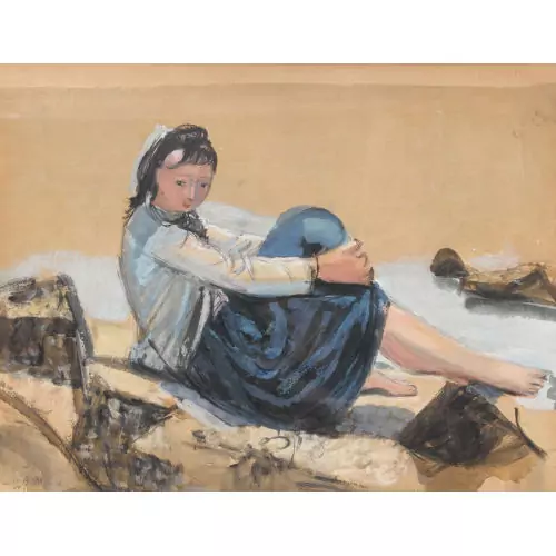 Sitzende Frau am Strand
