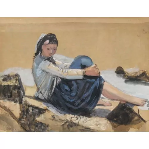Sitzende Frau am Strand