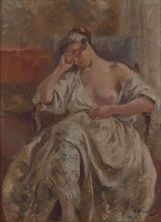 Femme assise à la robe blanche