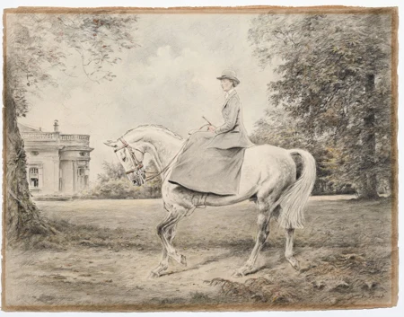 Cavalière dans le parc d'une demeure